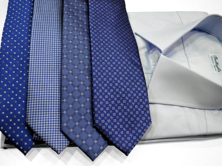 Cravatte in pura seta, fondo blu, varie fantasie